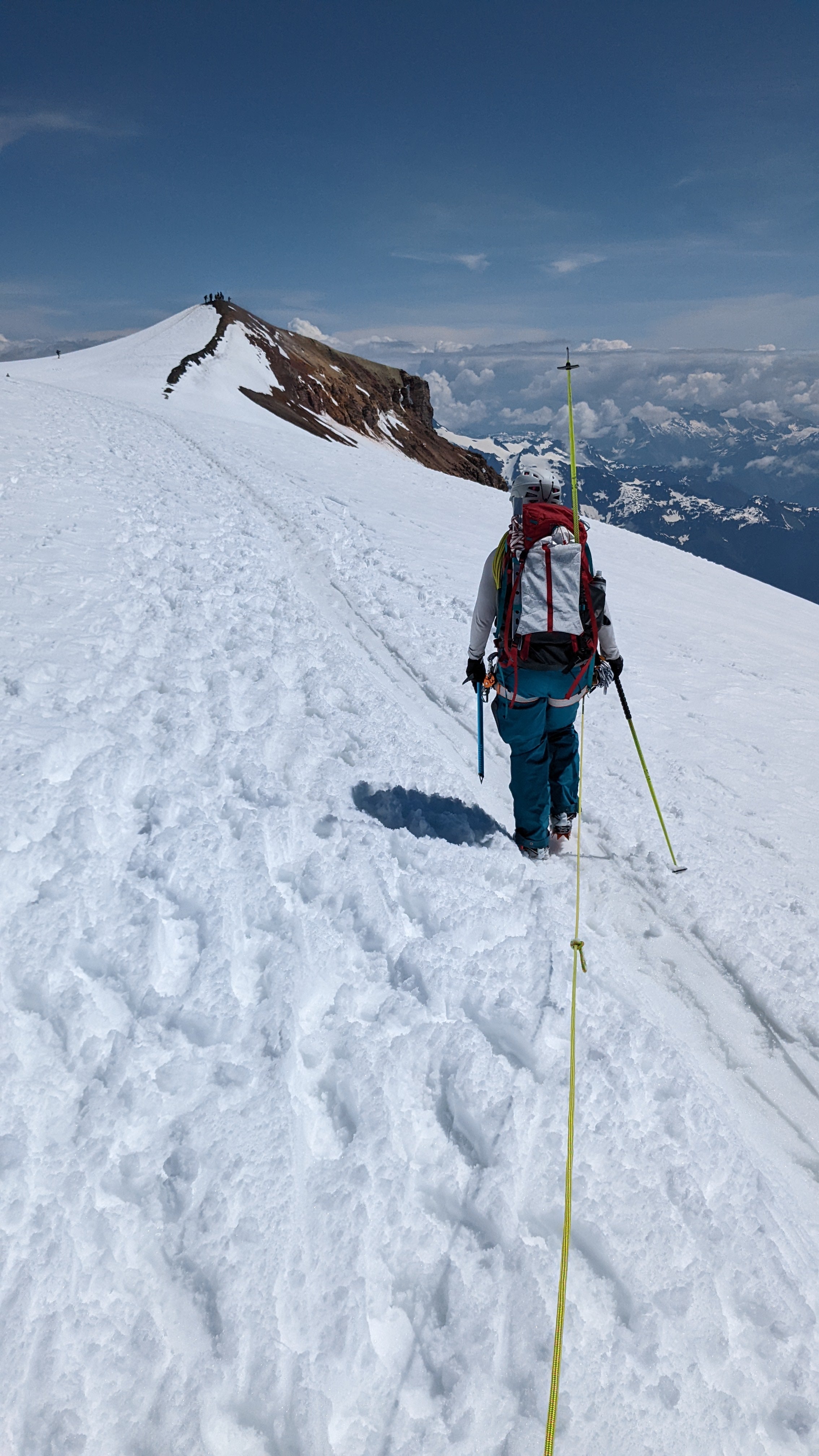 Woman hiking a mountain in snow